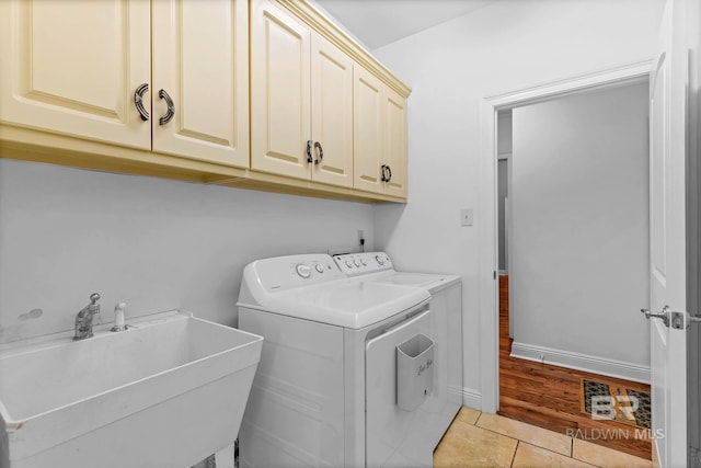 30230 Dolive Rdg, Daphne, AL 36527 - laundry room with cabinet space, washing machine and dryer, and light tile patterned floors