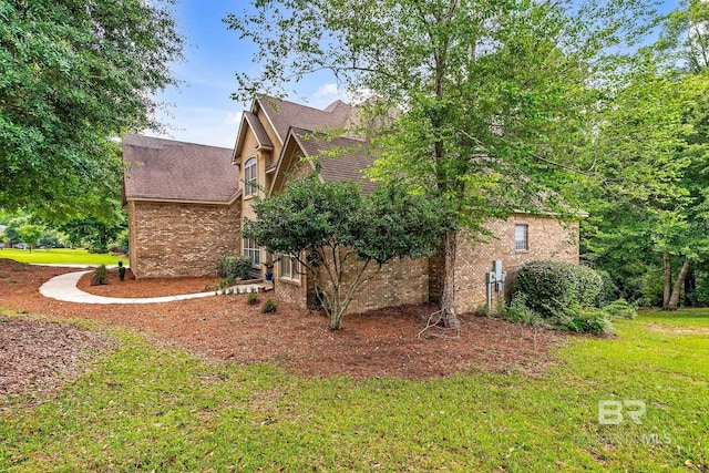 30230 Dolive Rdg, Daphne, AL 36527 - view of side of property with brick siding, roof with shingles, and a yard