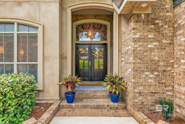 30230 Dolive Rdg, Daphne, AL 36527 - property entrance featuring french doors and brick siding