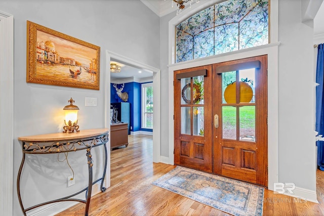 30230 Dolive Rdg, Daphne, AL 36527 - foyer featuring ornamental molding, light wood finished floors, a towering ceiling, and french doors