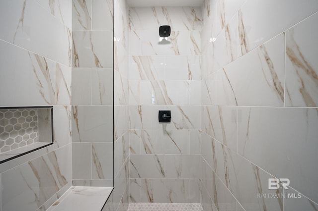 full bathroom with a tile shower