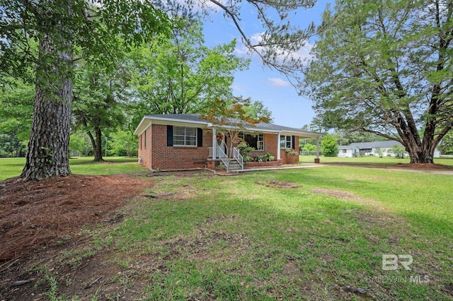 single story home featuring brick siding and a front yard
