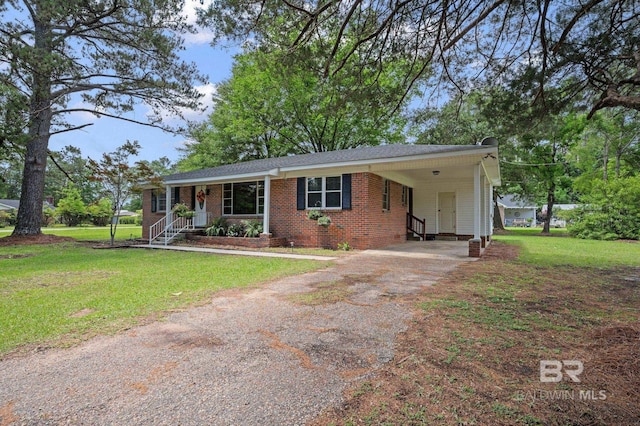 ranch-style home with asphalt driveway, a front lawn, an attached carport, crawl space, and entry steps