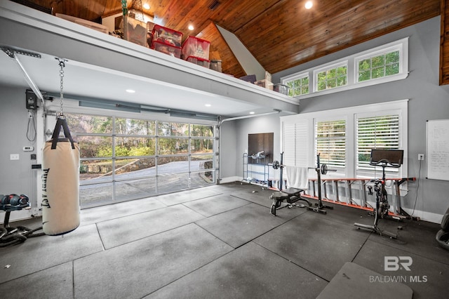 gym featuring a garage, baseboards, wood ceiling, high vaulted ceiling, and recessed lighting