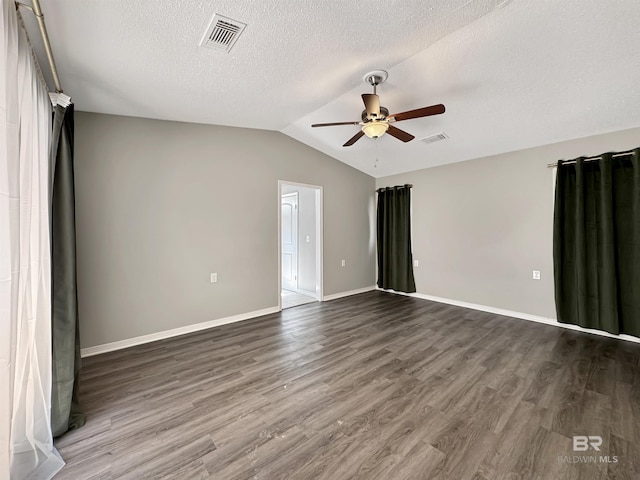 346 Shoreway Dr Unit 6, Gulf Shores, AL 36542 - unfurnished room with a ceiling fan, dark wood-style flooring, vaulted ceiling, and a textured ceiling