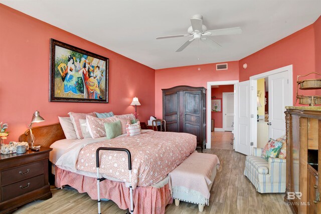 bedroom with light wood-type flooring and ceiling fan