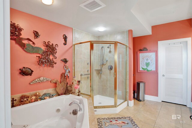 bathroom featuring independent shower and bath and tile patterned floors