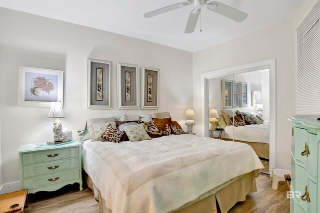 bedroom featuring a closet, ceiling fan, and light hardwood / wood-style flooring