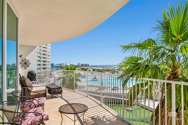 balcony featuring a water view