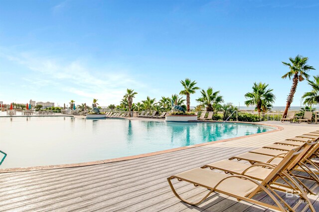 view of swimming pool with a water view