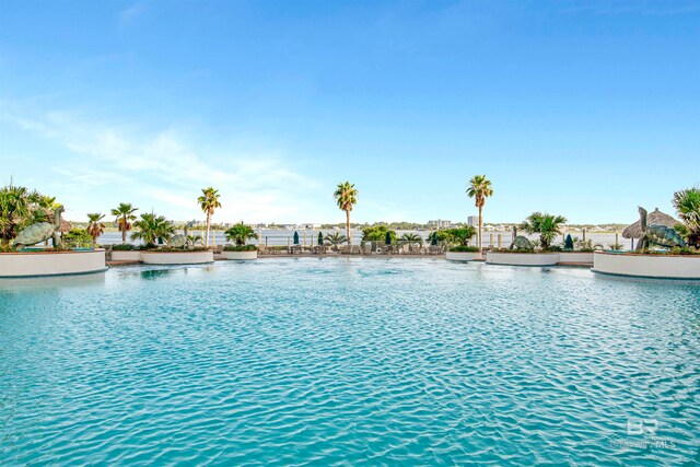 view of pool featuring a water view