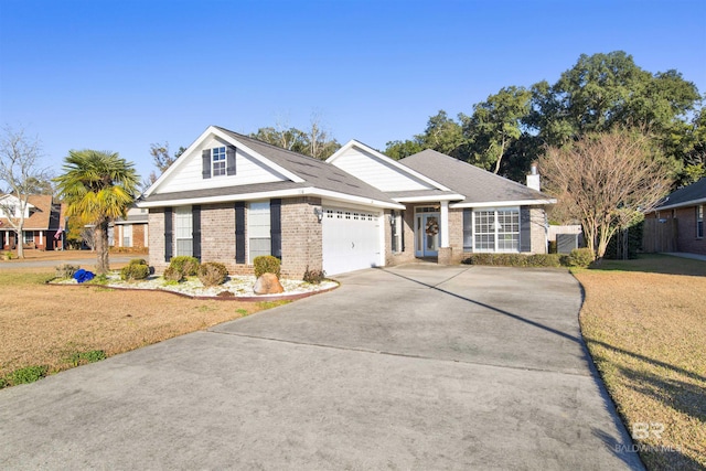 view of front of house with a garage and a front yard