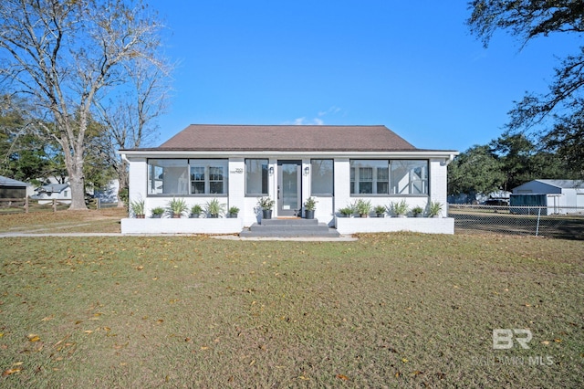 view of front of property with a front lawn