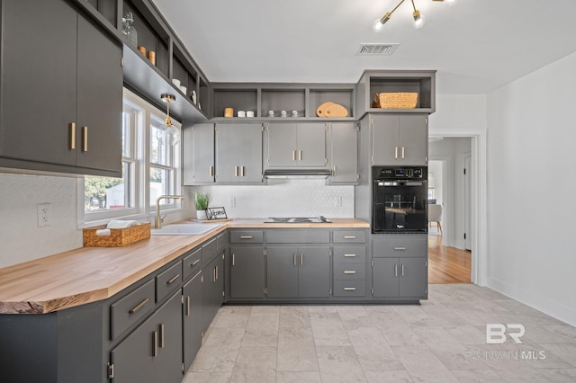 25121 State St, Elberta, AL 36530 - kitchen featuring gray cabinets, sink, oven, and stainless steel gas stovetop