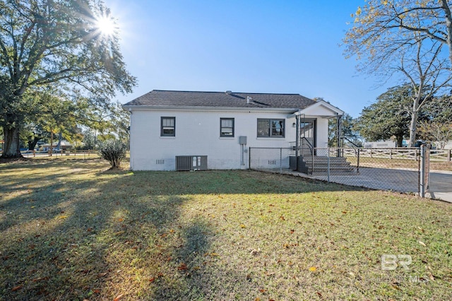 25121 State St, Elberta, AL 36530 - view of front of property featuring central AC and a front lawn