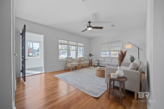25121 State St, Elberta, AL 36530 - living room featuring hardwood / wood-style floors, ceiling fan, and a healthy amount of sunlight