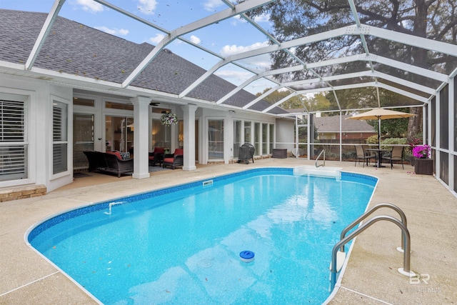 outdoor pool with french doors, a patio area, and a lanai