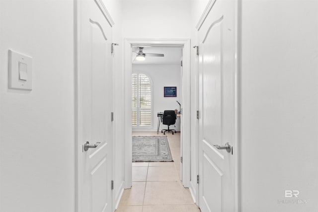 hall featuring light tile patterned floors