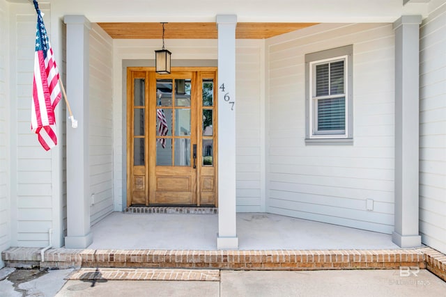 doorway to property with covered porch