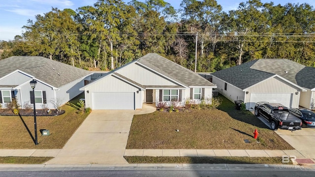 view of front of property with a garage and a front lawn