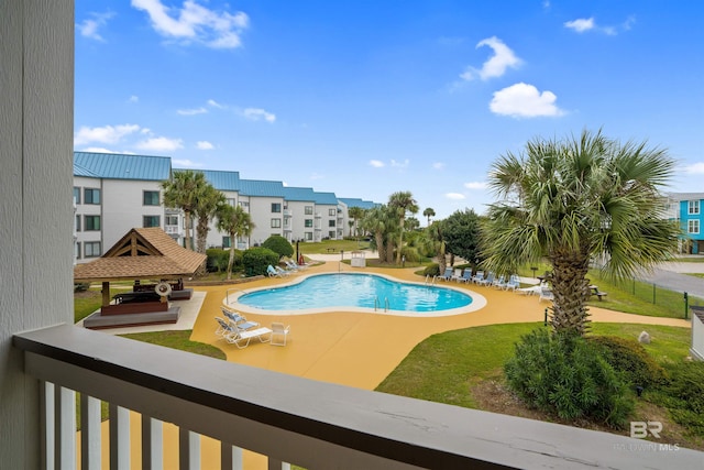 view of swimming pool with a patio