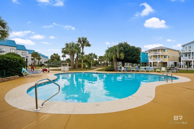 view of swimming pool featuring a patio area