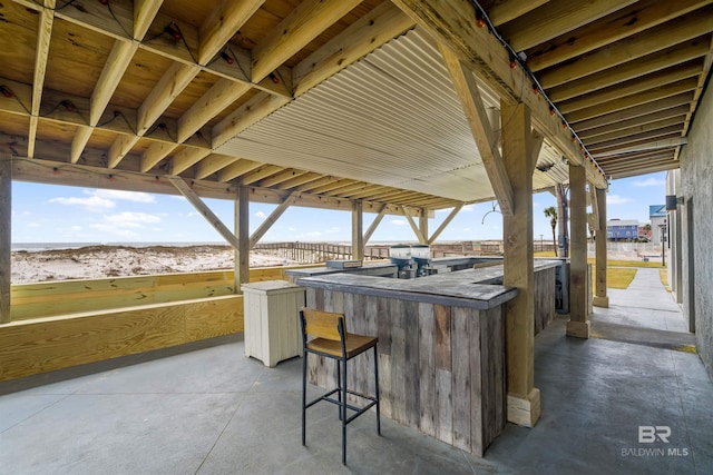 view of patio / terrace featuring an outdoor bar