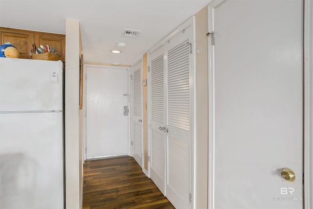 corridor featuring dark hardwood / wood-style flooring