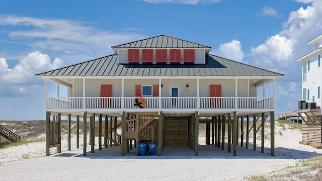 view of front of house with a carport and covered porch