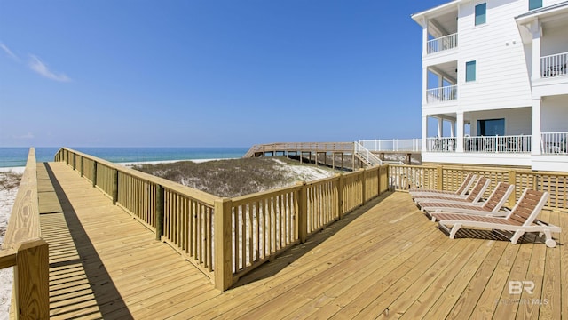 wooden deck featuring a water view