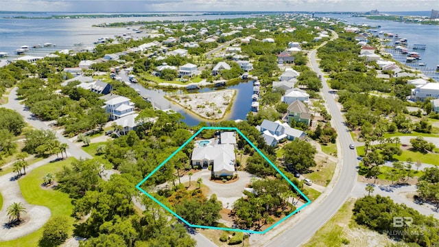 birds eye view of property with a water view