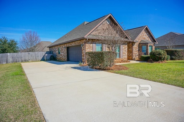 view of front of house with an attached garage, brick siding, fence, driveway, and a front lawn