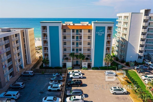 25360 Perdido Beach Blvd Unit 401, Orange Beach, AL 36561 - view of apartment building / complex featuring uncovered parking and a water view