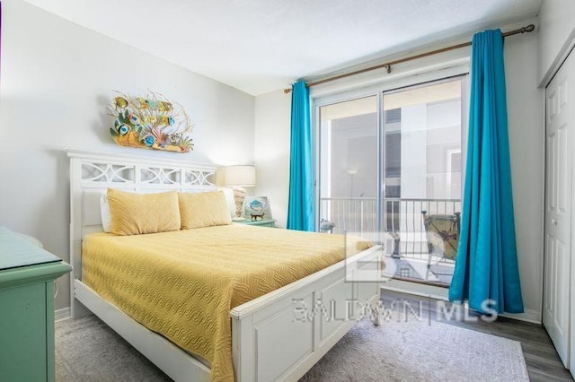 25360 Perdido Beach Blvd Unit 401, Orange Beach, AL 36561 - bedroom featuring access to outside, multiple windows, and wood finished floors