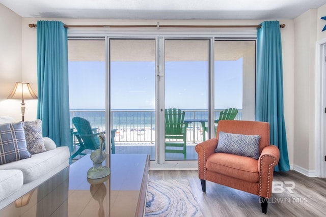 25360 Perdido Beach Blvd Unit 401, Orange Beach, AL 36561 - living area with wood finished floors and a water view