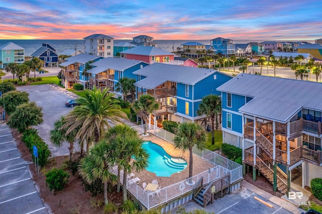 aerial view at dusk with a water view