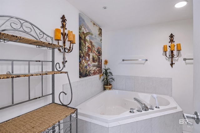 full bathroom with a tub with jets and recessed lighting