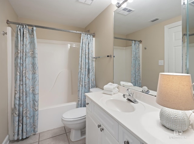 full bath featuring tile patterned floors, shower / tub combo with curtain, vanity, and toilet