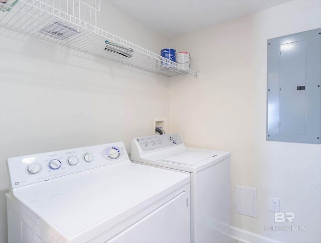 washroom with electric panel and independent washer and dryer