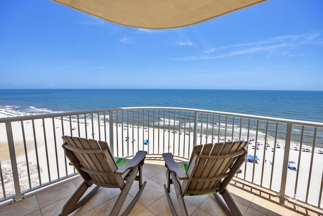 balcony featuring view of water and beach