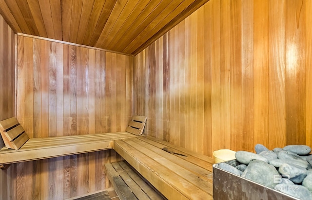 sauna with wooden walls and wooden ceiling