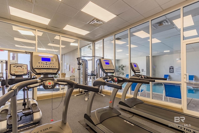 workout area featuring a drop ceiling