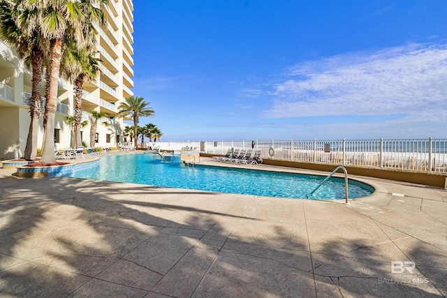community pool featuring a patio area
