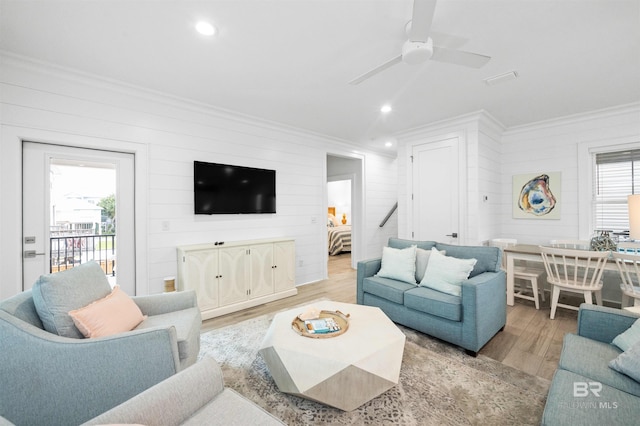1476 Sandpiper Ln Unit B, Gulf Shores, AL 36542 - living area with ornamental molding, wooden walls, wood finished floors, plenty of natural light, and recessed lighting