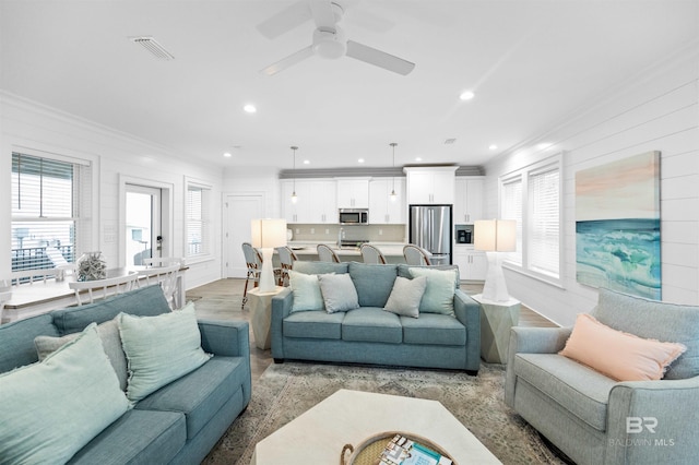 1476 Sandpiper Ln Unit B, Gulf Shores, AL 36542 - living room with ornamental molding, light wood-style floors, recessed lighting, and ceiling fan