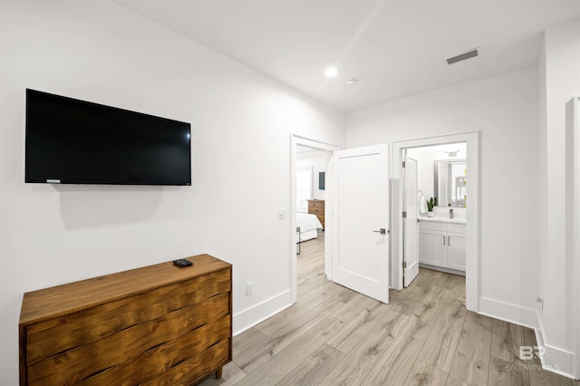 1476 Sandpiper Ln Unit B, Gulf Shores, AL 36542 - unfurnished bedroom with light wood-style flooring, baseboards, and ensuite bath