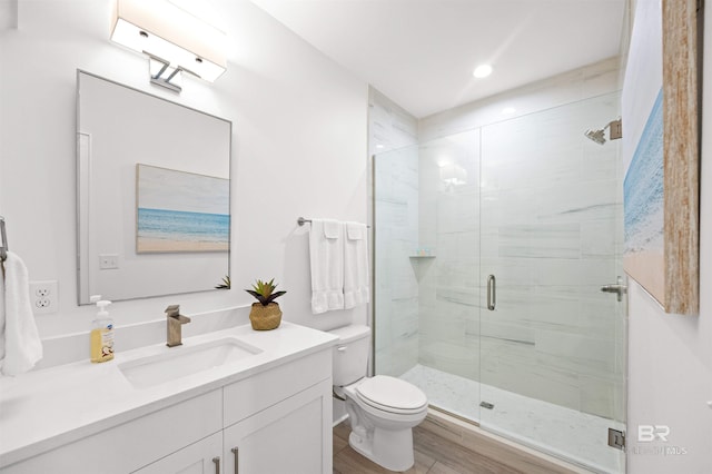 1476 Sandpiper Ln Unit B, Gulf Shores, AL 36542 - bathroom featuring vanity, a shower stall, wood finished floors, toilet, and recessed lighting