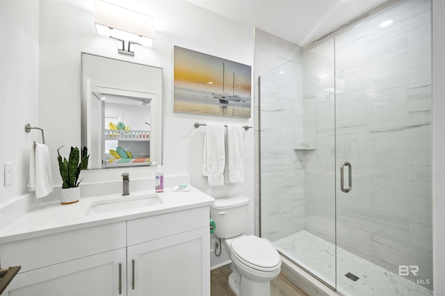 1476 Sandpiper Ln Unit B, Gulf Shores, AL 36542 - full bath featuring vanity, a stall shower, toilet, and wood finished floors
