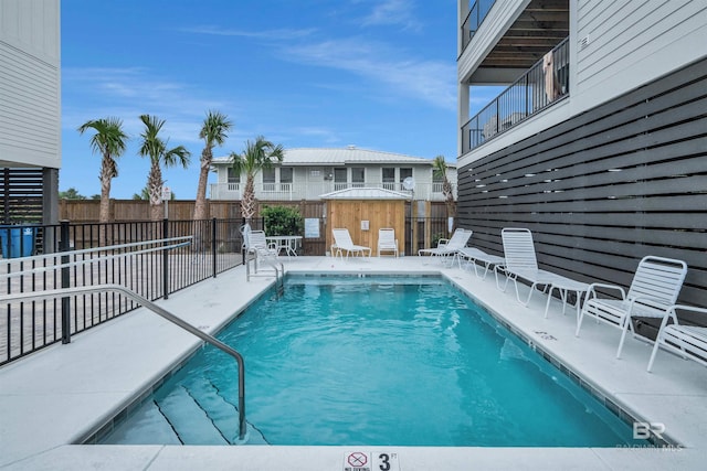 1476 Sandpiper Ln Unit B, Gulf Shores, AL 36542 - community pool featuring a fenced backyard and a patio