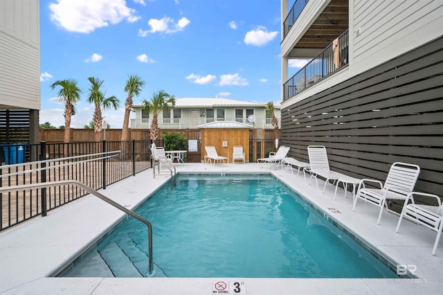 1476 Sandpiper Ln Unit B, Gulf Shores, AL 36542 - community pool featuring a fenced backyard and a patio area